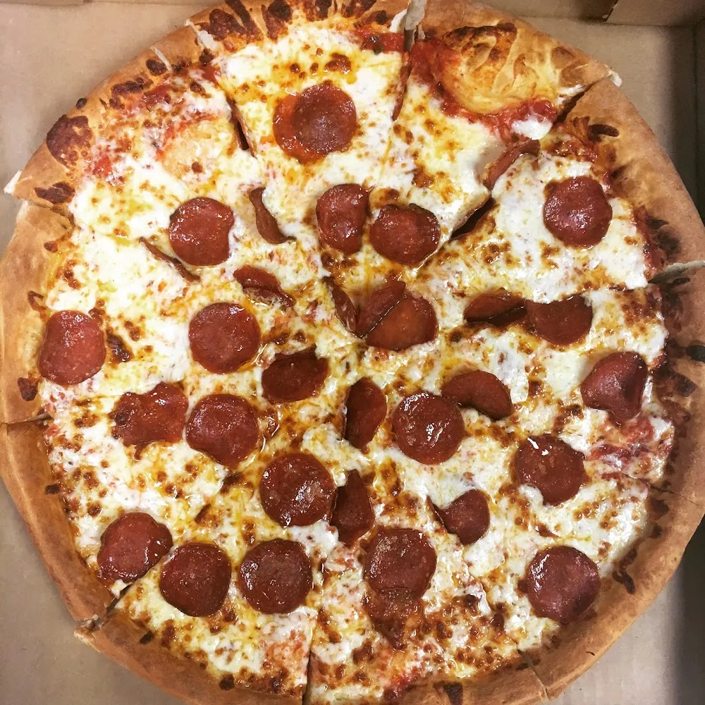 Crispy Pepperoni Pizza on Hand